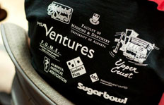 Sponsors on the t-shirts for the Asclepius Medical Youth Camp