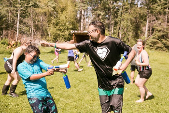 Project lead Devin Chetan having fun with campers