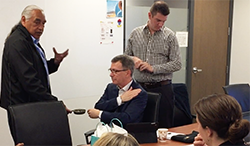 At a 2018 meeting of the Indigenous Health Committee, members participated in a smudging ceremony conducted by Elder Emil Durocher.